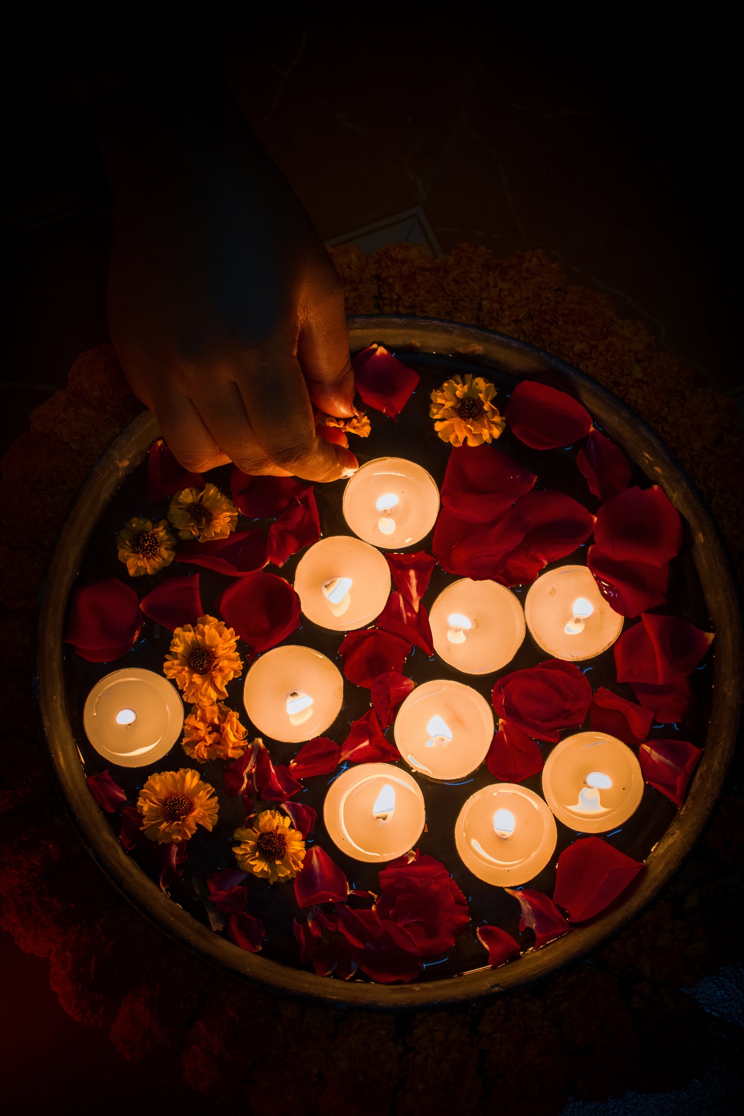 tealights-and-colorful-flowers-in-dish